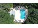 Kidney shaped community pool with surrounding lounge chairs at 11847 Skylake Pl # D, Tampa, FL 33617