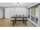 Bright dining area with a farmhouse table and large windows at 120 89Th Ne Ave, St Petersburg, FL 33702