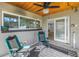 Relaxing screened porch with patio furniture and view of living room at 120 89Th Ne Ave, St Petersburg, FL 33702