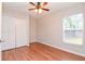 Bright bedroom with wood floors and a double door closet at 13012 Creek Manor Ct, Riverview, FL 33569