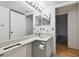 Bathroom with gray vanity, double sinks at 13215 Slash Pine Dr # H, Hudson, FL 34669