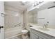 Bathroom with gray vanity, single sink and shower/tub combo at 13215 Slash Pine Dr # H, Hudson, FL 34669
