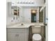 Bathroom with gray vanity, double sinks at 13215 Slash Pine Dr # H, Hudson, FL 34669