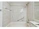 Bathroom with shower/tub combo and tiled walls at 13215 Slash Pine Dr # H, Hudson, FL 34669