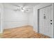 Bright entryway with light wood floors and ceiling fan at 13215 Slash Pine Dr # H, Hudson, FL 34669