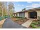 Building exterior with a curved pathway and green space at 13215 Slash Pine Dr # H, Hudson, FL 34669