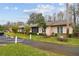Exterior view of building, showing landscaping at 13215 Slash Pine Dr # H, Hudson, FL 34669