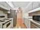 Efficient kitchen with light cabinets, and stainless steel appliances at 13215 Slash Pine Dr # H, Hudson, FL 34669