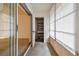 Enclosed lanai with sliding glass doors and storage at 13215 Slash Pine Dr # H, Hudson, FL 34669
