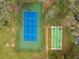 Overhead view of tennis court and shuffleboard court at 13215 Slash Pine Dr # H, Hudson, FL 34669