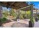 Lush backyard patio featuring a pergola and brick pavers at 1402 E Mohawk Ave, Tampa, FL 33604