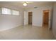 Bedroom with tiled floor, a closet and access to a bathroom at 1469 Normandy Park Dr # 1, Clearwater, FL 33756