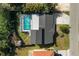 Overhead view of a house with a pool and a fenced backyard at 177 Dowling Ne Ave, Port Charlotte, FL 33952