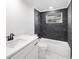 Clean bathroom with dark tile and white vanity at 177 Dowling Ne Ave, Port Charlotte, FL 33952