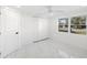 White bedroom with double door closet and new flooring at 177 Dowling Ne Ave, Port Charlotte, FL 33952