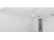 Spacious bedroom with ceiling fan and access to hallway at 177 Dowling Ne Ave, Port Charlotte, FL 33952