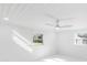 Bright bedroom with ceiling fan, new flooring, and large windows at 177 Dowling Ne Ave, Port Charlotte, FL 33952