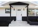 Modern front door with black and white accents at 177 Dowling Ne Ave, Port Charlotte, FL 33952