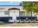 Modern front entrance with white door and black accents at 177 Dowling Ne Ave, Port Charlotte, FL 33952