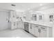 Modern kitchen with white cabinets and stainless steel appliances at 177 Dowling Ne Ave, Port Charlotte, FL 33952