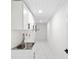 Clean laundry room with white cabinets and marble floor at 177 Dowling Ne Ave, Port Charlotte, FL 33952