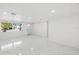 Bright living room with white walls and marble floors at 177 Dowling Ne Ave, Port Charlotte, FL 33952