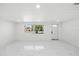 Spacious living room with marble floors and large windows at 177 Dowling Ne Ave, Port Charlotte, FL 33952
