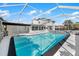 Large, screened-in pool with stone accents at 177 Dowling Ne Ave, Port Charlotte, FL 33952