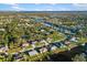 Aerial view of the neighborhood showcasing waterfront properties at 18434 Goodman Cir, Port Charlotte, FL 33948