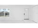 Bright entryway with white door and large windows at 18434 Goodman Cir, Port Charlotte, FL 33948