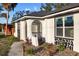 Charming house with unique architectural details and landscaping at 18434 Goodman Cir, Port Charlotte, FL 33948