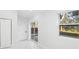 Laundry room with sliding glass doors leading to the backyard at 18434 Goodman Cir, Port Charlotte, FL 33948