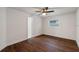 Spacious bedroom with dark laminate flooring and ceiling fan at 1849 New Hampshire Ne Ave, St Petersburg, FL 33703