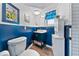 Navy blue and white bathroom with walk-in shower at 1985 Byram Dr, Clearwater, FL 33755