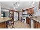 Modern kitchen with granite countertops and ample wood cabinetry at 1985 Byram Dr, Clearwater, FL 33755