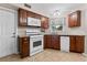 Updated kitchen with white appliances and granite countertops at 1985 Byram Dr, Clearwater, FL 33755