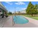 Inviting kidney-shaped pool with a concrete deck at 1985 Byram Dr, Clearwater, FL 33755