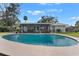 Stunning kidney-shaped pool in a backyard oasis at 1985 Byram Dr, Clearwater, FL 33755