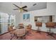 Dining area with glass table and four chairs, kitchen view at 2058 Villa Ter, Clearwater, FL 33763