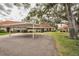 View of the villa's carport and surrounding landscape at 2058 Villa Ter, Clearwater, FL 33763