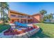 Landscaped backyard with pool, patio, and water views at 207 8Th E St, Tierra Verde, FL 33715