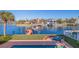 Waterfront backyard oasis with private dock, pool, and lounge chairs at 207 8Th E St, Tierra Verde, FL 33715