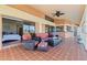 Relaxing balcony with tiled floor and outdoor furniture, offering water views at 207 8Th E St, Tierra Verde, FL 33715