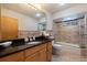 Bathroom with granite vanity, large mirror, and walk-in shower at 207 8Th E St, Tierra Verde, FL 33715