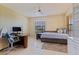 Bright bedroom with built-in shelving, desk, and daybed at 207 8Th E St, Tierra Verde, FL 33715