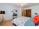 Bedroom with a queen-size bed and built-in shelving at 207 8Th E St, Tierra Verde, FL 33715