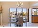 Waterfront dining area with glass table and chairs, offering stunning views at 207 8Th E St, Tierra Verde, FL 33715