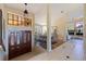Bright and spacious entryway with double doors and high ceilings at 207 8Th E St, Tierra Verde, FL 33715