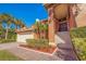 Grand entrance with tiled stairs and manicured landscaping at 207 8Th E St, Tierra Verde, FL 33715