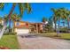 Attractive two-story home with tile roof and spacious driveway at 207 8Th E St, Tierra Verde, FL 33715